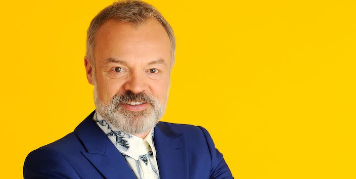 graham norton in blue jacket and multi coloured tie
