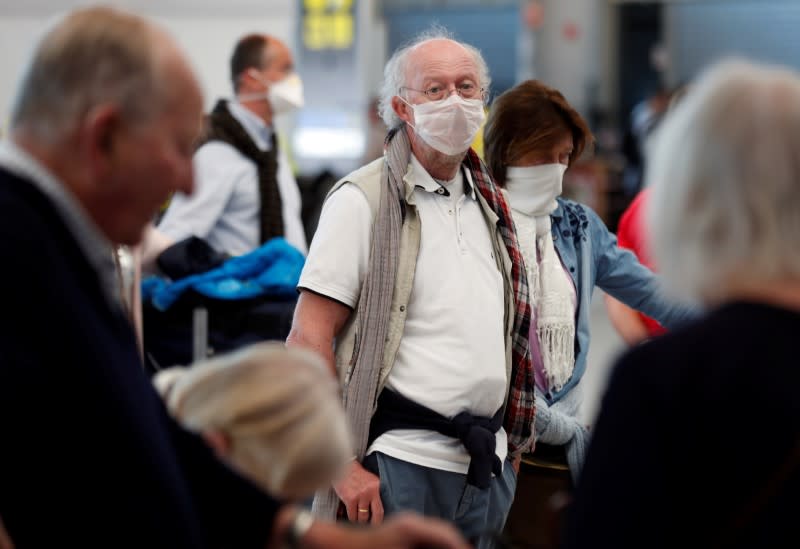 Tourists at Gran Canaria airport wait to return to their countries after the closure of hotels during the health emergency of coronavirus disease (COVID-19)