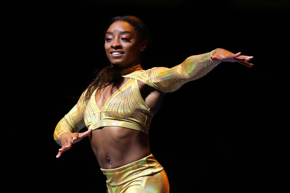 LOS ANGELES, CALIFORNIA - SEPTEMBER 25: Simone Biles performs during the Gold Over America Tour at Staples Center on September 25, 2021 in Los Angeles, California. (Photo by Katharine Lotze/Getty Images)