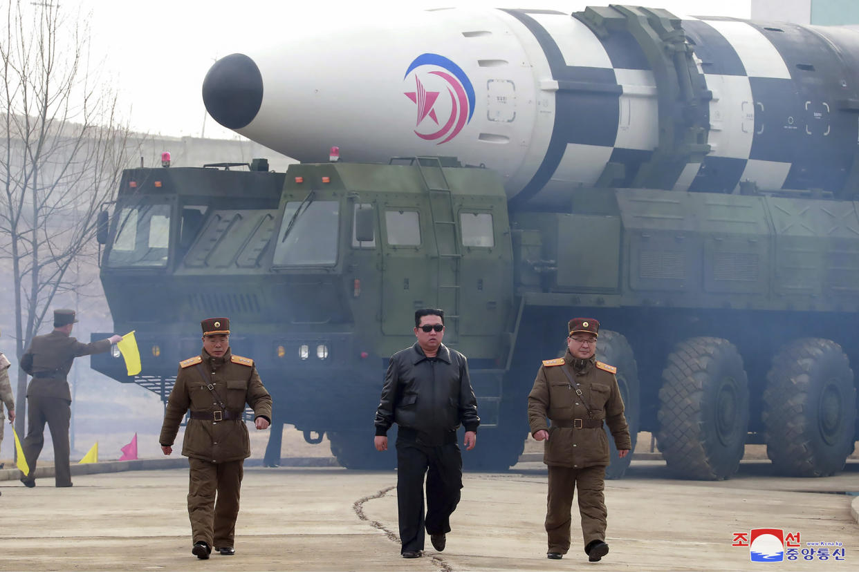 FILE - In this photo distributed by the North Korean government, North Korean leader Kim Jong Un, center, walks around what it says a Hwasong-17 intercontinental ballistic missile (ICBM) on the launcher, at an undisclosed location in North Korea on March 24, 2022. Independent journalists were not given access to cover the event depicted in this image distributed by the North Korean government. The content of this image is as provided and cannot be independently verified. Korean language watermark on image as provided by source reads: "KCNA" which is the abbreviation for Korean Central News Agency. (Korean Central News Agency/Korea News Service via AP, File)