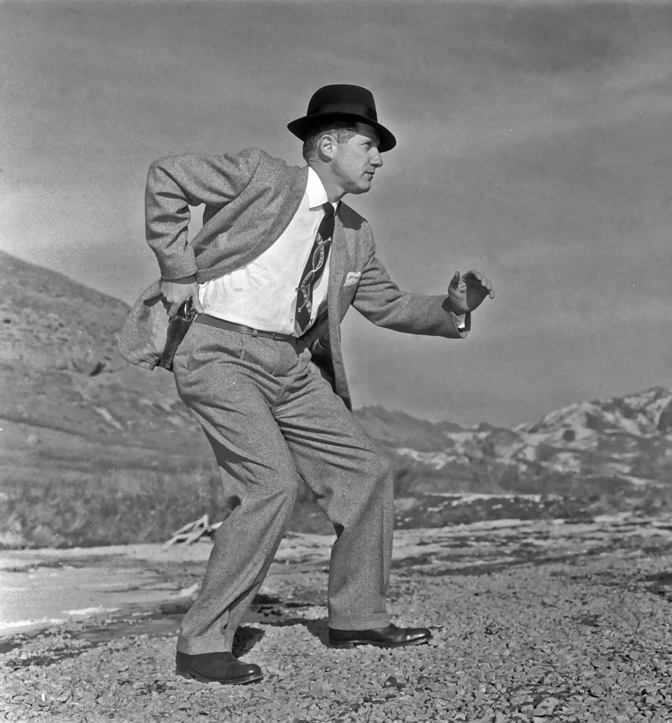 SALT LAKE CITY - JANUARY 20: (FILE PHOTO)(News Mags Out Until June 14, 2005)  Mark Felt posing for a picture with his pistol drawn for a newspaper story in this photo taken January 20, 1958 in Salt Lake City, Utah. An article written in Vanity Fair magazine in June 2005 claims that Felt was 'Deep Throat', the long-anonymous source who leaked secrets about President Nixon's Watergate cover-up to The Washington Post in the early 1970's.  (Photo by Howard Moore/Deseret Morning News/Getty Images)