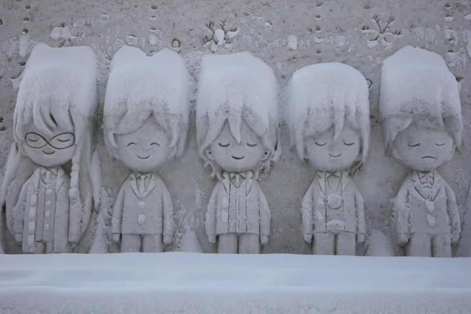 A snow sculpture is covered with fresh snow at the Sapporo Snow Festival, Feb. 6, 2020, in Sapporo, Hokkaido, Japan. (AP Photo/Jae C. Hong)
