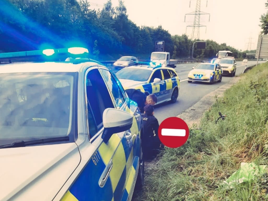 Police force the cyclist on to the verge of the motorway and arrested him 