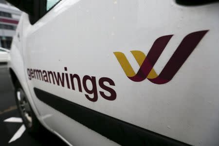 A Germanwings logo is pictured at a door of a car outside the Germanwings headquarters at Cologne-Bonn airport March 28, 2015. REUTERS/Wolfgang Rattay