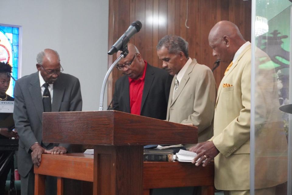 Deacons of Mount Olive Primitive Baptist church lead devotion during a service Sunday celebrating the 2nd anniversary of Pastor Christopher Whitehead as pastor of the church.
(Credit: Photo provided by Voleer Thomas)