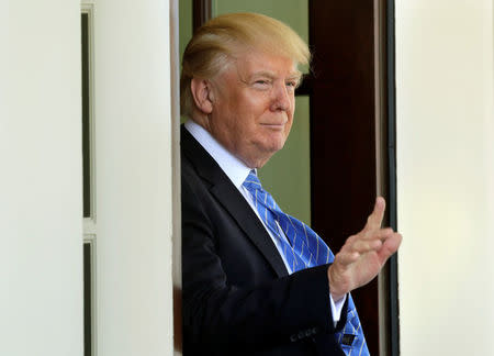 U.S. President Donald Trump gestures to the media after Palestinian President Mahmoud Abbas left the White House in Washington, U.S., May 3, 2017. REUTERS/Yuri Gripas