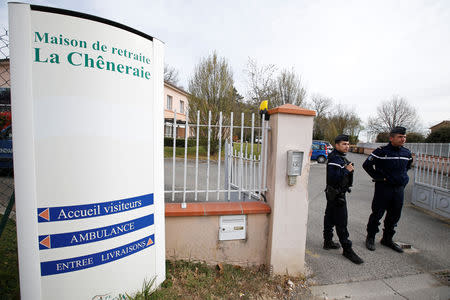 French gendarmes stand at the entrance of the "La Cheneraie" EHPAD (Housing Establishment for Elderly Dependant People) care home following the deaths of five people as a result of suspected food poisoning in Lherm, southern France, April 1, 2019. REUTERS/Regis Duvignau