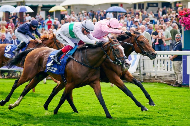 Warm Heart (pink) wins Thursday's Group 1 Yorkshire Oaks, likely headed to Breeders' Cup. Photo by Dominick James, Eclipse Sportswire, courtesy of Breeders' Cup