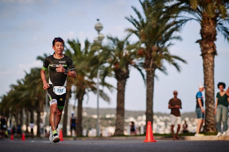 A triathlete runs at Ironman France 2022 in Nice, France.