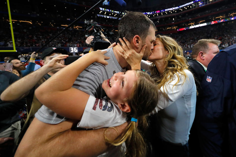 ATLANTA, GA - FEBRUARY 03:  Tom Brady #12 of the New England Patriots kisses his wife Gisele Bündchen after the Super Bowl LIII against the Los Angeles Rams at Mercedes-Benz Stadium on February 3, 2019 in Atlanta, Georgia. The New England Patriots defeat the Los Angeles Rams 13-3.  (Photo by Kevin C. Cox/Getty Images)