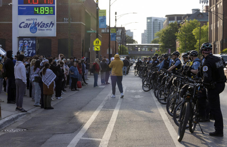 Protesters face off with Chicago police across the street from DePaul University in Chicago, Thursday, May 16, 2024. Police closed off the campus quad after dismantling a pro-Palestinian encampment. Students at many college campuses this spring set up similar encampments, calling for their schools to cut ties with Israel and businesses that support it, to protest lsrael's actions in the war with Hamas. (AP Photo/Teresa Crawford)