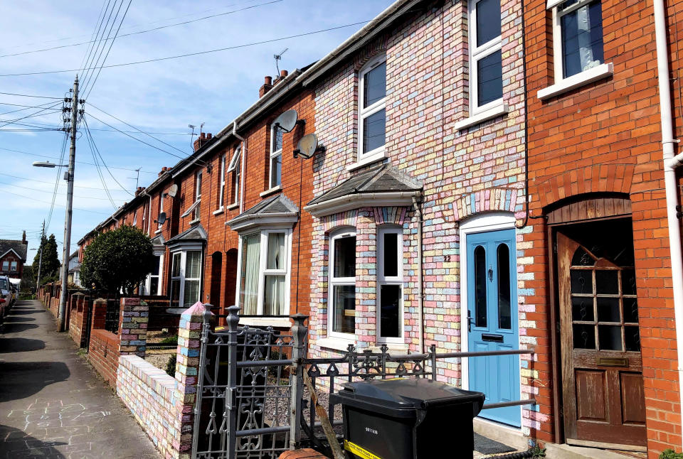 A family have painted their house with rainbow coloured chalk to give their neighbours a lift during coronavirus lockdown. (SWNS)