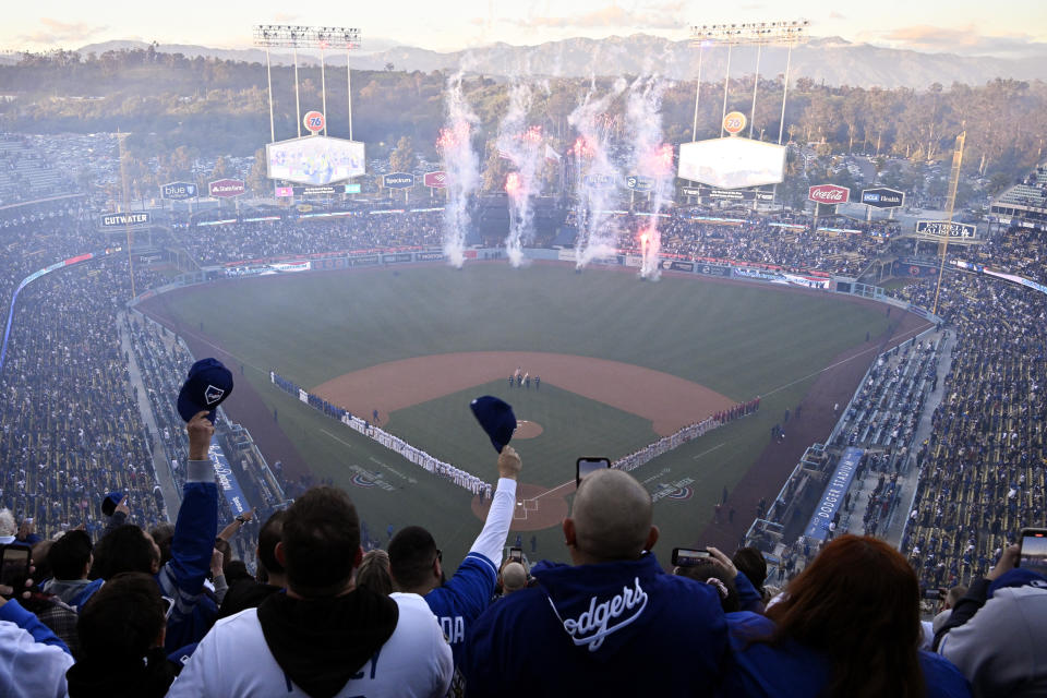 Fans cheer during the national anthem prior to an opening day baseball game between the Los Angeles Dodgers and the Arizona Diamondbacks Thursday, March 30, 2023, in Los Angeles. (AP Photo/Mark J. Terrill)