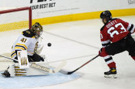 Boston Bruins goaltender Jaroslav Halak (41) makes a save on a shot by New Jersey Devils left wing Jesper Bratt (63) during the first period of an NHL hockey game, Tuesday, May 4, 2021, in Newark, N.J. (AP Photo/Kathy Willens)