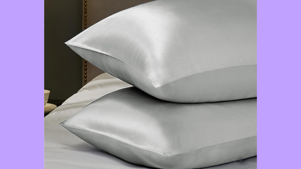 two silver satin pillowcases