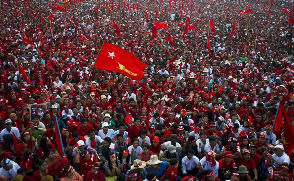 Supporters of Myanmar opposition leader Aung San Suu Kyi listen as she speaks during a campaign rally for the National League for Democracy in Yangon on 1 November 2015.