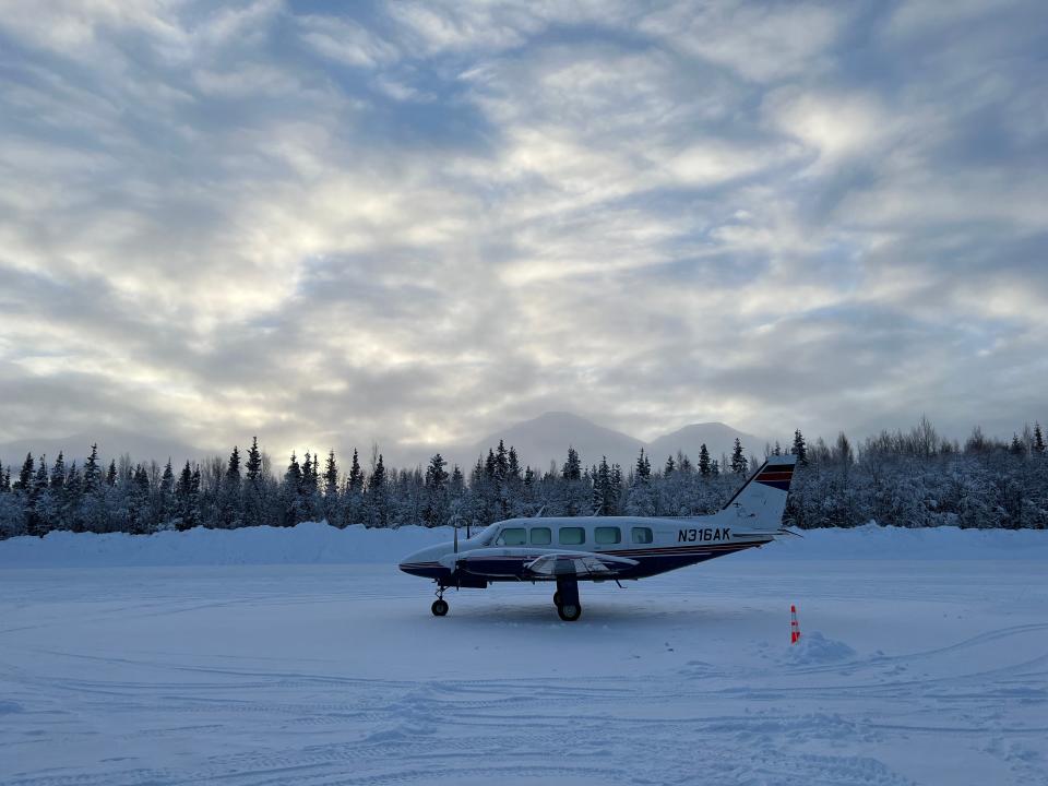 plane on a frozen tundra in alaska