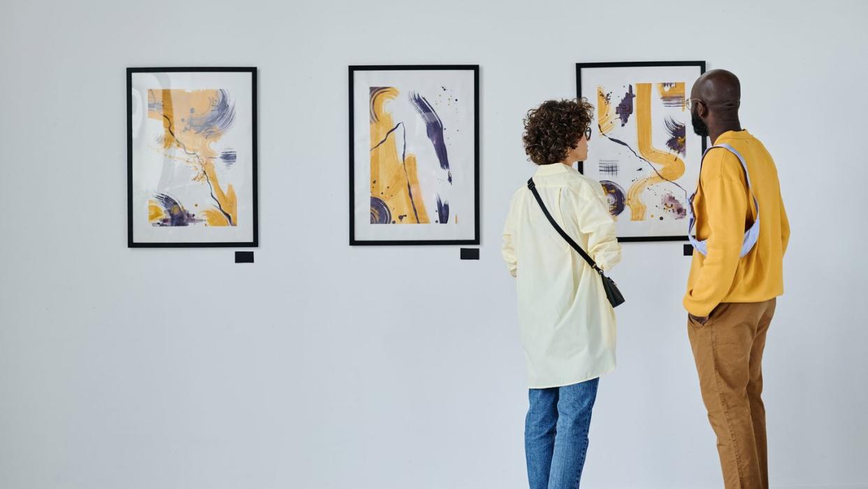 young couple visiting art gallery