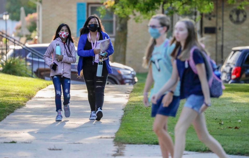 Students arrive at Urban Middle School, Wednesday, September 1, 2021, in Sheboygan, Wis.