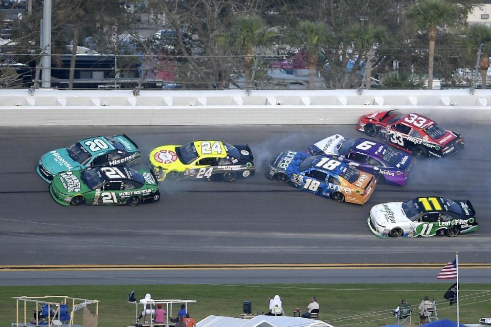 Erik Jones (20), Daniel Hemric (21), Scott Lagasse Jr (24), Daniel Suarez (18), Darrell Wallace Jr (6), Brandon Jones (33) and Blake Koch (11) get involved in a multi-car accident between Turns 3 and 4 during a NASCAR Xfinity series auto race at Daytona International Speedway, Saturday, Feb. 25, 2017, in Daytona Beach, Fla. (AP Photo/Phelan M. Ebenhack)