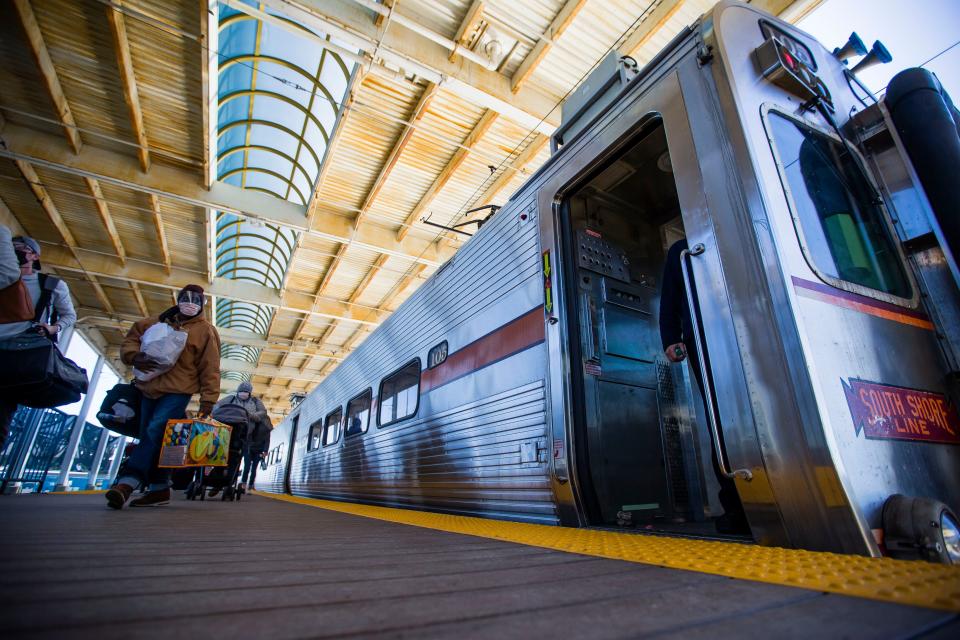 Passengers exit a train at the South Shore station at South Bend International Airport. Dana Sandoval of Cassopolis opted to take the South Shore to fly out of Chicago due to high flight prices.