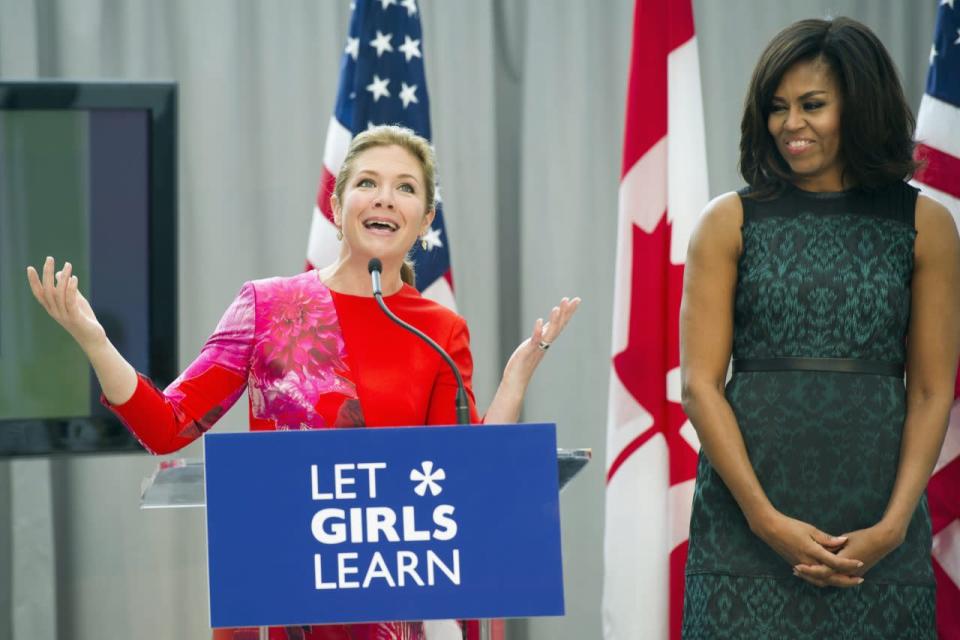 First lady Michelle Obama listens as Sophie Grégoire-Trudeau, wife of Prime Minister Justin Trudeau, speaks during a program at the U.S. Institute of Peace in Washington, Thursday, March 10, 2016, to highlight Let Girls Learn efforts and raise awareness for global girl’s education. (AP Photo/Cliff Owen)