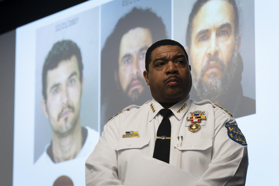 Interim Police Commissioner John Stanford, Jr. stands in front of a projected images of suspect Elias Diaz during a news conference in Philadelphia, Tuesday, Dec. 19, 2023. Authorities say Diaz, accused of slashing people with a large knife while riding a bicycle on a rail trail in Philadelphia, is now a person of interest in the cold-case murder of a medical student that occurred among a series of high-profile sexual assaults two decades ago. (AP Photo/Matt Rourke)