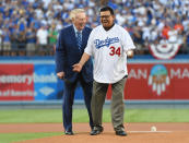 <p>Los Angeles Dodgers former broadcaster Vin Scully (left) hands the ball to former pitcher Fernando Valenzuela for the ceremonial first pitch in game two of the 2017 World Series against the Houston Astros at Dodger Stadium. Mandatory Credit: Jayne Kamin-Oncea-USA TODAY Sports </p>