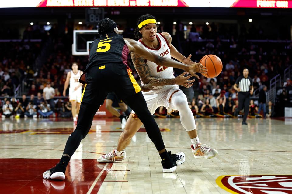 Tre White (22) of the USC Trojans drives in a game against Arizona State in Los Angeles. March 4, 2023