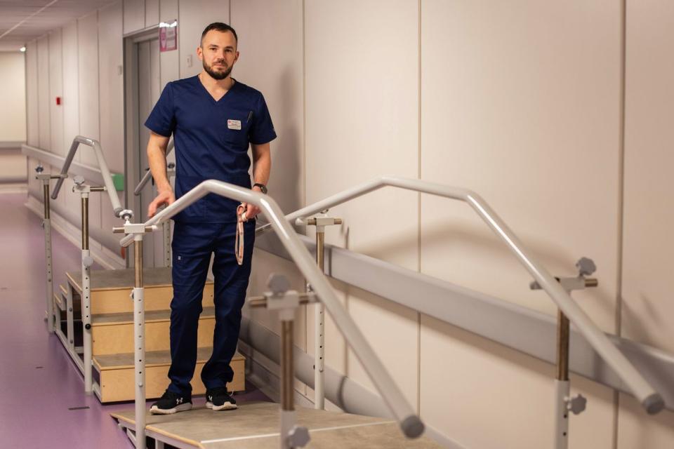 Nazar Borozniuk, a physical therapist at Ohmatdyt hospital on March 21, 2024, in Kyiv, Ukraine. (Oleh Tymoshenko / The Kyiv Independent)