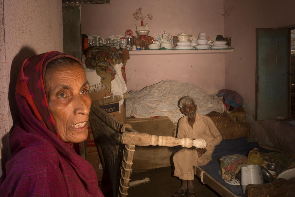 Bano and Abdul Ghani inside their flooded house in Jhuddo, Sept. 9.<span class="copyright">Hassaan Gondal for TIME</span>