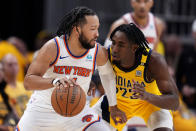 New York Knicks guard Jalen Brunson drives around Indiana Pacers forward Aaron Nesmith (23) during the second half of Game 3 in an NBA basketball second-round playoff series, Friday, May 10, 2024, in Indianapolis. (AP Photo/Michael Conroy)