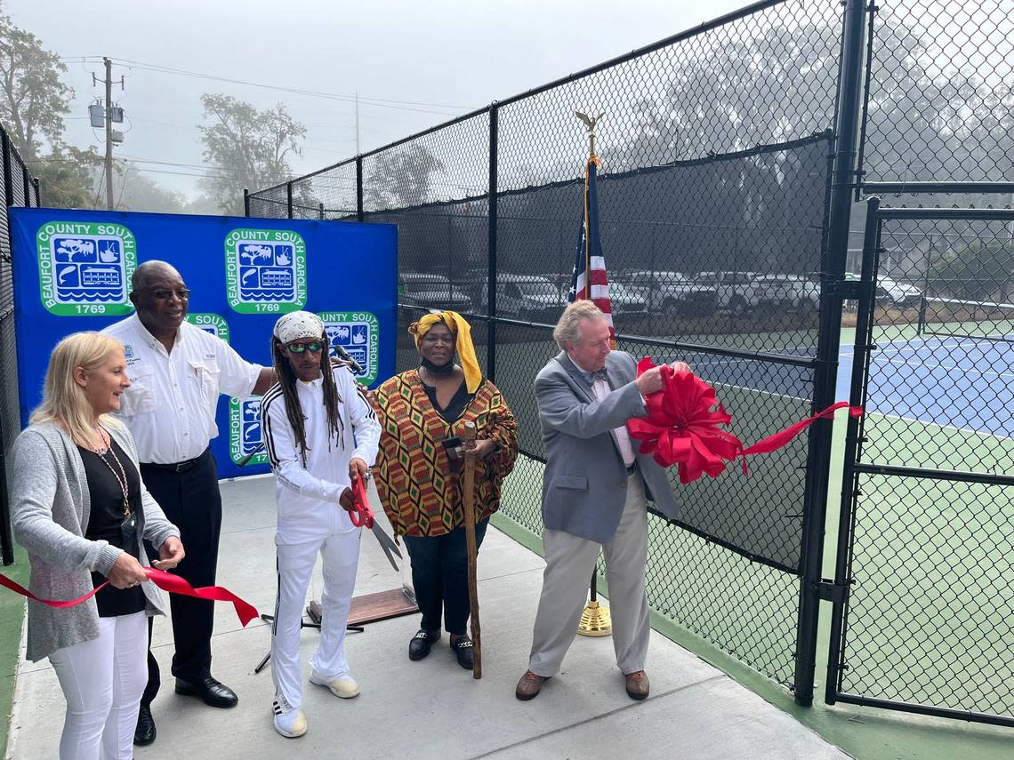 Beaufort’s downtown tennis courts have undergone $630,000 in renovations. Celebrating the reopening of the courts Tuesday were (from left to right) Shannon Loper, Beaufort County’s Parks and Recreation Director; County Councilman York Glover; tennis coach Larry Scheper; Anita Singleton-Prather; and Marshall Williams of the Beaufort Tennis Club.