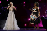 Carrie Underwood, left, and CeCe Winans perform at the 56th annual Academy of Country Music Awards on Saturday, April 17, 2021, at the Grand Ole Opry in Nashville, Tenn. The awards show airs on April 18 with both live and prerecorded segments. (AP Photo/Mark Humphrey)