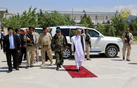 Afghanistan's President Ashraf Ghani (R) arrives to visit the victims of April 21's attack on an army headquarters, in Mazar-i-Sharif, northern Afghanistan April 22, 2017. Presidential Palace /Handout via REUTERS