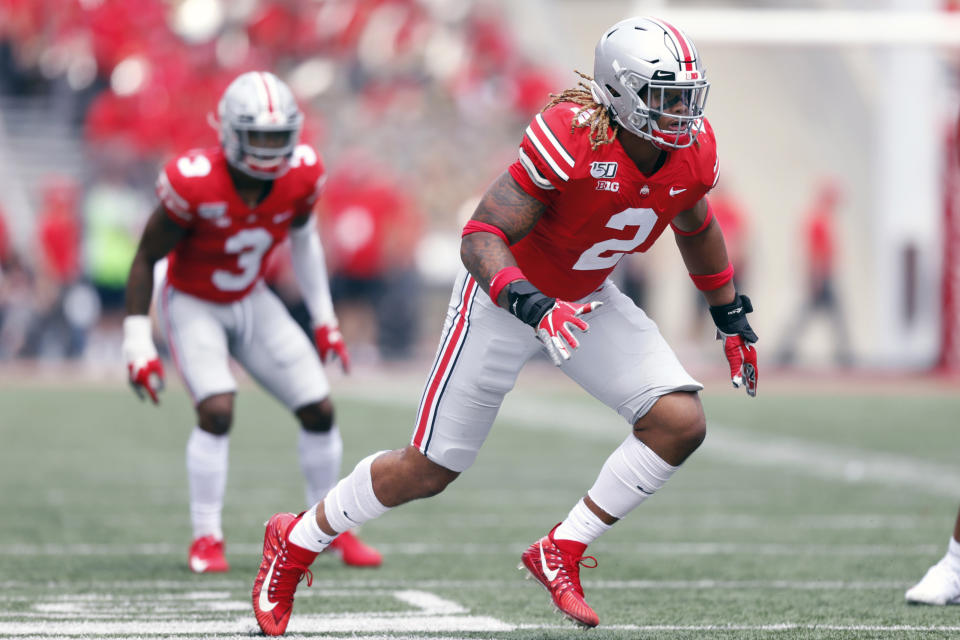 FILE - In this Aug. 31, 2019, file photo, Ohio State defensive end Chase Young, right, works against Florida Atlantic during an NCAA football game, in Columbus, Ohio. Ohio State said, Wednesday, Nov. 13, 2019, the NCAA has concluded that star DE Chase Young must sit out one more football game before he can return. (AP Photo/Paul Vernon, File)