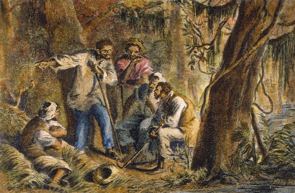 Nat Turner and his companions are shown in a wooded area in 1831. <a href="https://www.gettyimages.com/detail/news-photo/american-slave-leader-nat-turner-and-his-companions-are-news-photo/116050949?phrase=nat%20turner&adppopup=true" rel="nofollow noopener" target="_blank" data-ylk="slk:Stock Montage/Getty Images;elm:context_link;itc:0;sec:content-canvas" class="link ">Stock Montage/Getty Images</a>