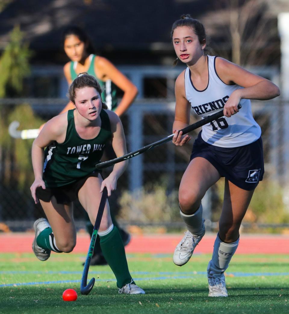 Tower Hill's Sophia Bellingham (left) and Wilmington Friends' Molly Dolan work for the ball during Friends' 3-2 overtime win.