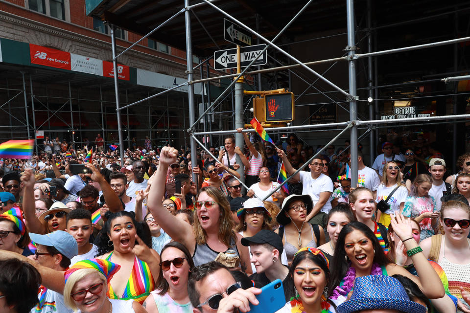 People wave rainbow flags on top street posts during the N.Y.C. Pride Parade in New York on June 30, 2019. (Photo: Gordon Donovan/Yahoo News)