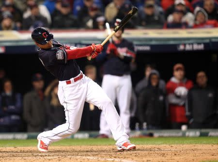 Oct 26, 2016; Cleveland, OH, USA; Cleveland Indians pinch hitter Brandon Guyer hits a single against the Chicago Cubs in the 7th inning in game two of the 2016 World Series at Progressive Field. Charles LeClaire-USA TODAY Sports