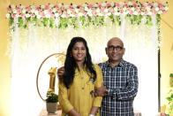 In this undated photo provided by Srinivas Chaluvadi, Chaluvadi, right, founder of Perfect General Contractors, poses with Aishwarya Thatikonda, a civil engineer at the company. Thatikonda was among the victims of Saturday's mass shooting on May 6, 2023, at Allen Premium Outlets, in Allen, Texas. (Courtesy of Srinivas Chaluvadi via AP)