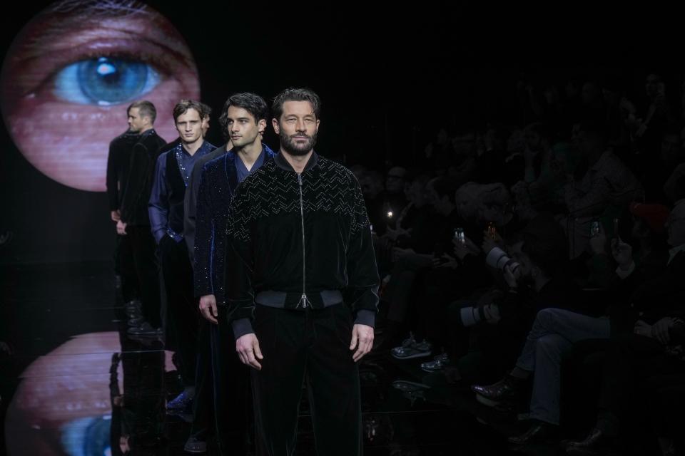 Models wear creations part of the men's Giorgio Armani Fall-Winter 2024-2025 collection, that was presented in Milan, Italy, Sunday, Jan. 14, 2024. (AP Photo/Antonio Calanni).