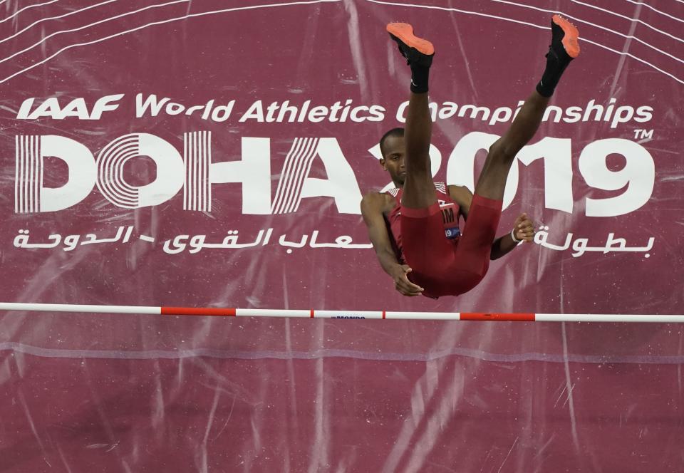 Mutaz Essa Barshim, of Qatar, clears the bar during the men's high jump finals at the World Athletics Championships in Doha, Qatar, Friday, Oct. 4, 2019. (AP Photo/Morry Gash)