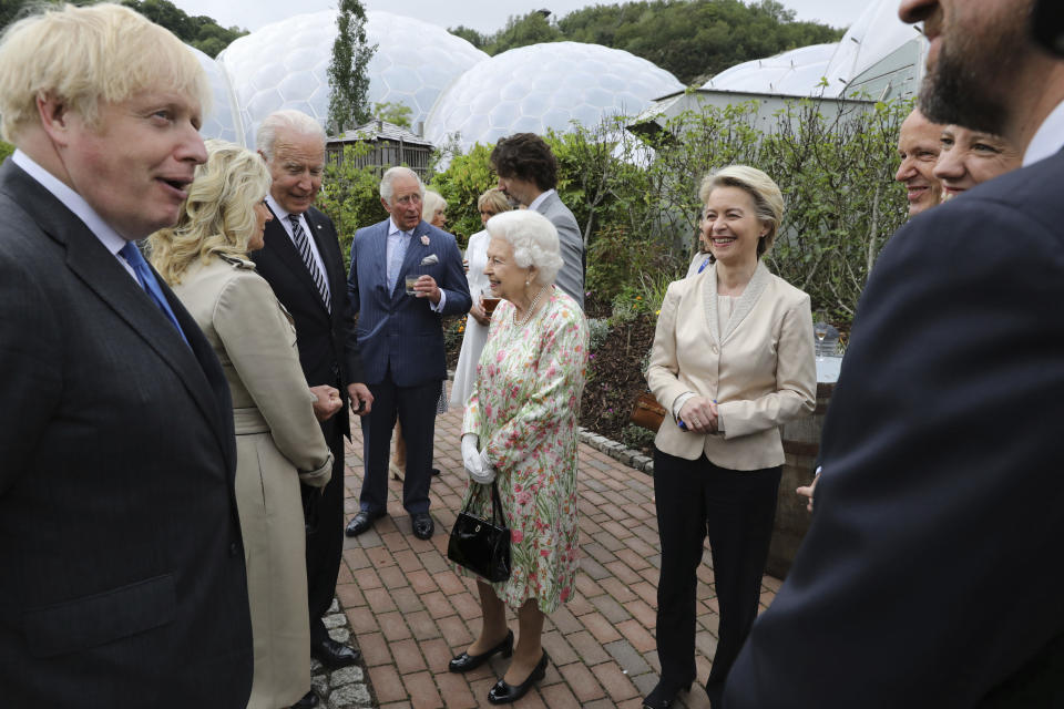 Britain's Queen Elizabeth II speaks to U.S. President Joe Biden and his wife Jill Biden during reception with the G7 leaders at the Eden Project in Cornwall, England, Friday June 11, 2021, during the G7 summit. (Jack Hill/Pool via AP)