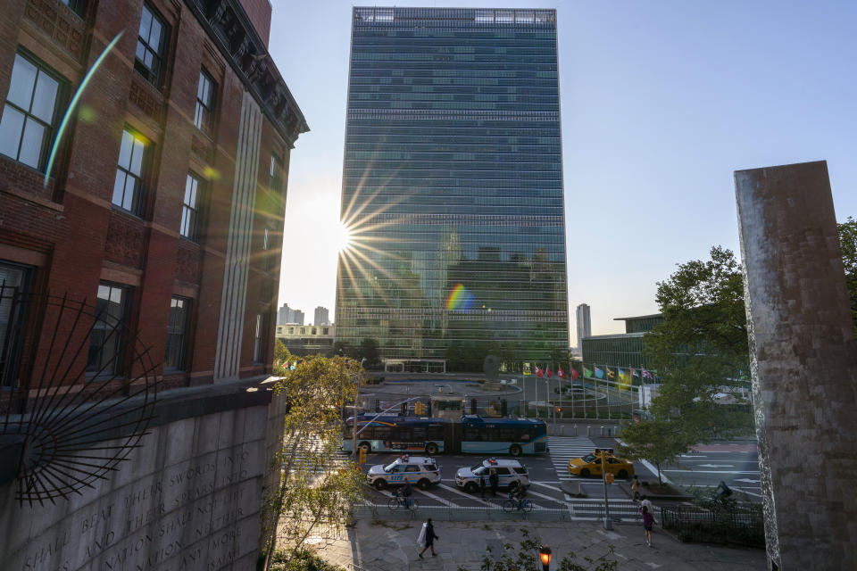 FILE - Traffic and pedestrians make their way up First Avenue in front of United Nations headquarters in New York during the 75th session of the United Nations General Assembly, Wednesday, Sept. 23, 2020. A major United Nations meeting on the landmark nuclear Non-Proliferation Treaty is starting Monday, Aug. 1, 2022, after a long delay due to the COVID-19 pandemic, as Russia’s war in Ukraine has reanimated fears of nuclear confrontation and cranked up the urgency of trying reinforce the 50-year-old treaty. (AP Photo/Mary Altaffer, File)