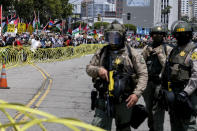 Police officers keep watch outside the Federal Building as demonstrators march to Israeli Consulate during a protest against Israel and in support of Palestinians, Saturday, May 15, 2021 in the Westwood section of Los Angeles. (AP Photo/Ringo H.W. Chiu)