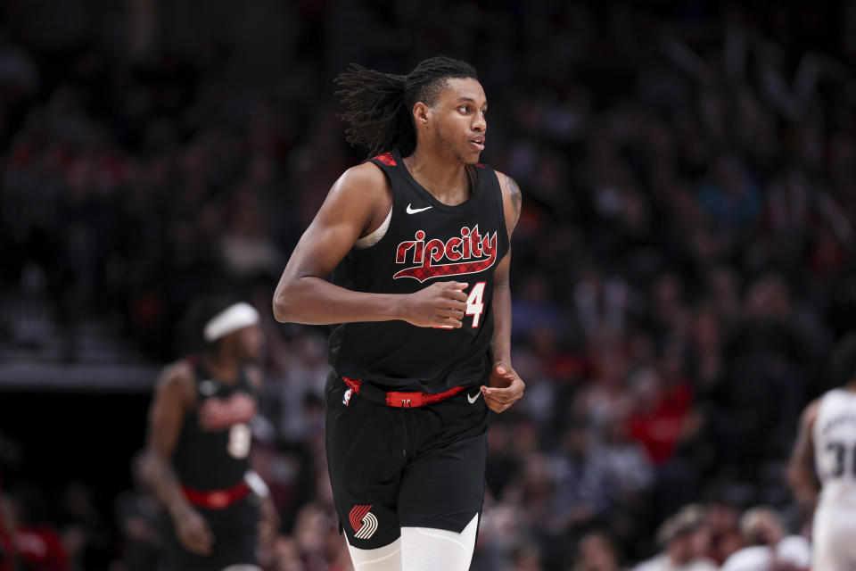 Portland Trail Blazers forward Jabari Walker runs back to defend against the San Antonio Spurs during the second half of an NBA basketball game Friday, Dec. 29, 2023, in Portland, Ore. (AP Photo/Howard Lao)