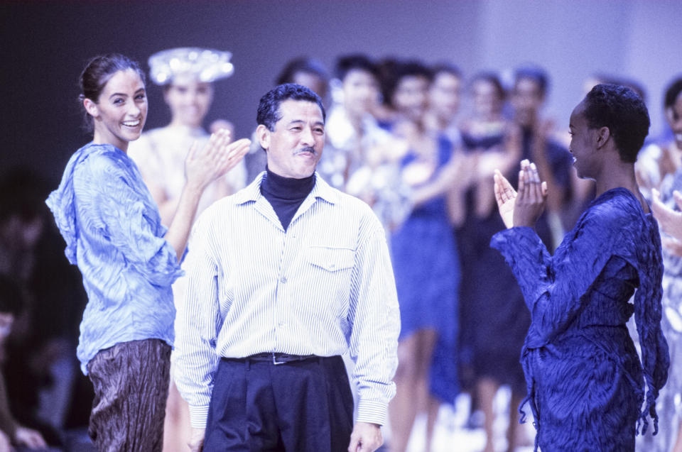Issey Miyake with models at his spring 1992 runway presentation in France.&nbsp; (Photo: Pool ARNAL/GARCIA via Getty Images)