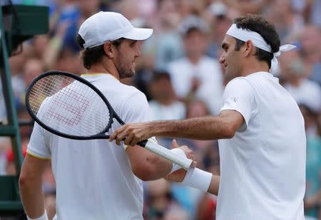 Tennis - Wimbledon - London, Britain - July 8, 2017 Switzerland’s Roger Federer with Germany’s Mischa Zverev after winning their third round match REUTERS/Andrew Couldridge