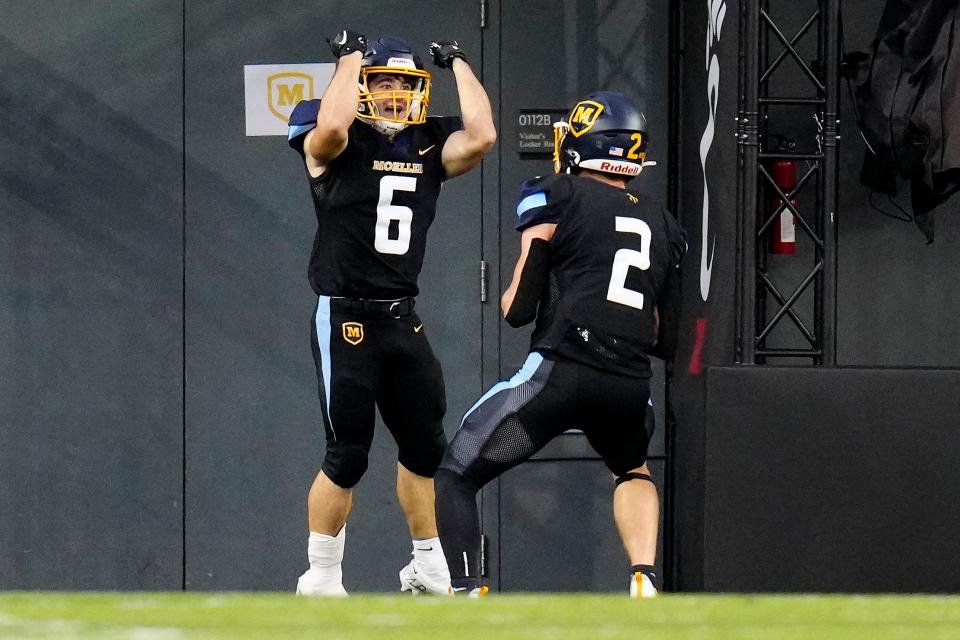 Moeller running back Alec Weeder (6) celebrates a long touchdown run in the first quarter of the game between the Elder High School Panthers and the Moeller High School Crusaders at Nippert Stadium in Cincinnati on Friday, Sept. 30, 2022. Moeller took a decisive 42-14 victory over Elder. 